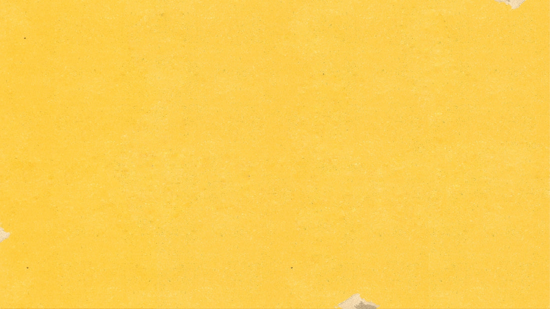 a piece of yellow paper with torn edges